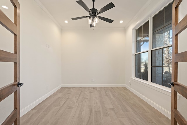 empty room featuring crown molding, ceiling fan, and light hardwood / wood-style flooring