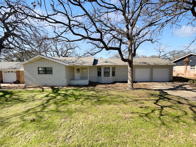 ranch-style home featuring a garage and a front yard