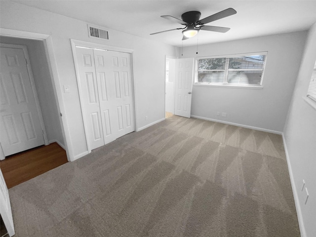 unfurnished bedroom featuring ceiling fan, carpet floors, and a closet