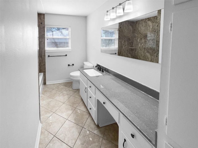 bathroom featuring vanity, tile patterned floors, and toilet