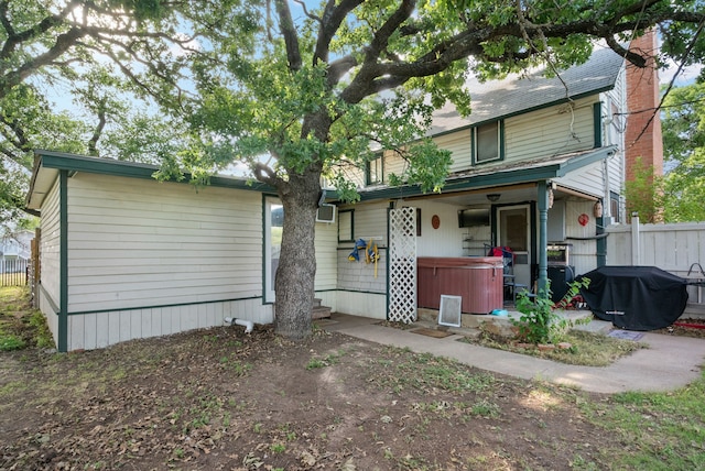 view of front of home with a hot tub