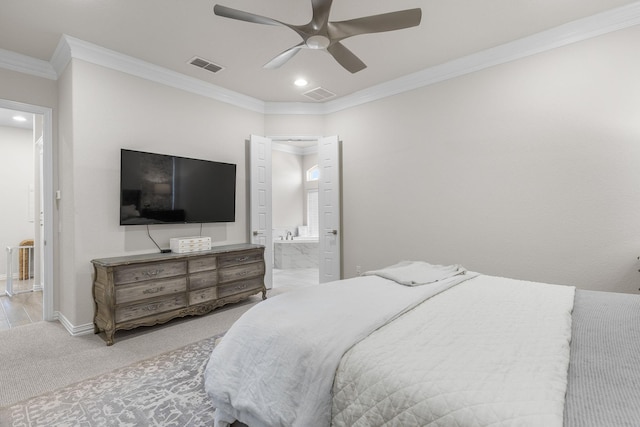 carpeted bedroom with ensuite bath, ornamental molding, and ceiling fan