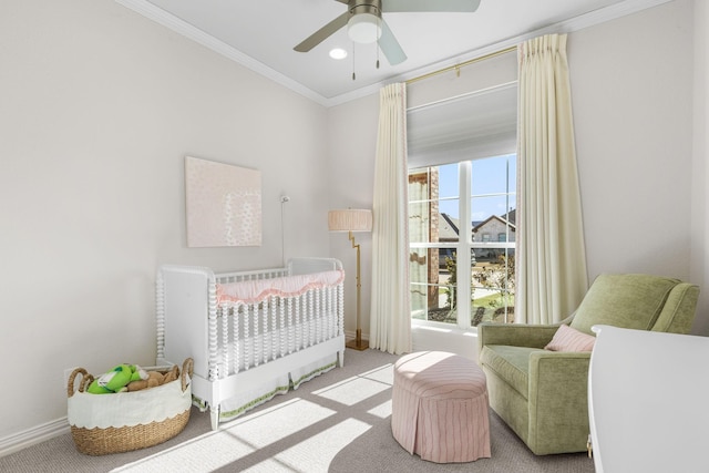 bedroom featuring light carpet, crown molding, and ceiling fan