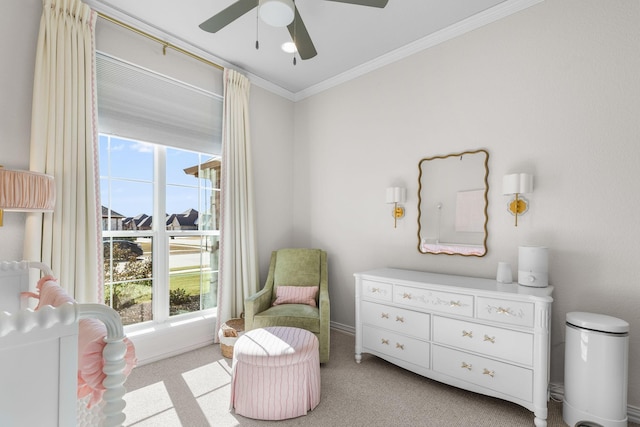 living area featuring crown molding, light colored carpet, and ceiling fan