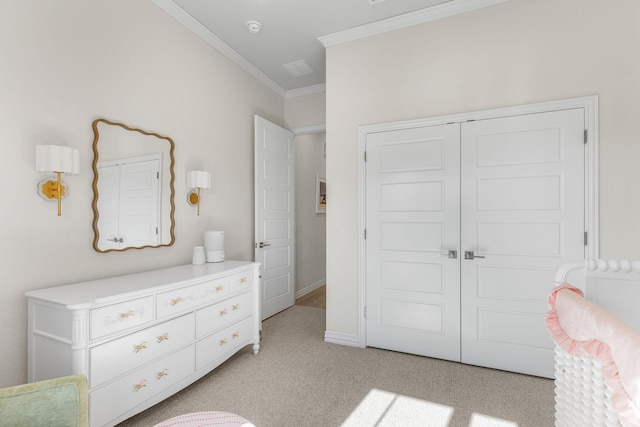 bedroom featuring light colored carpet, ornamental molding, and a closet