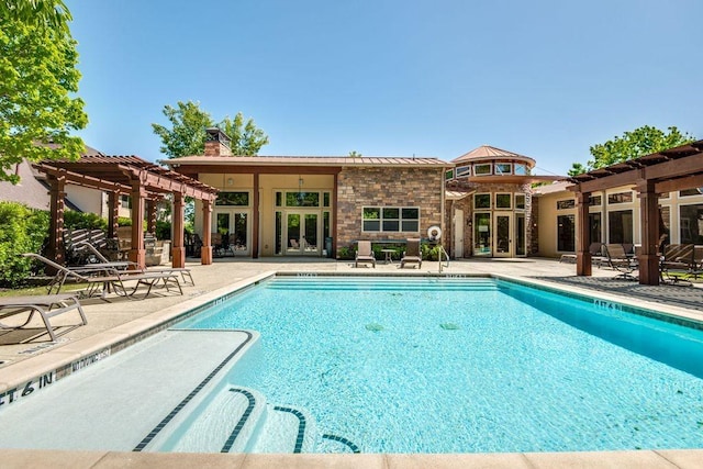 view of swimming pool with a pergola, a patio area, and french doors