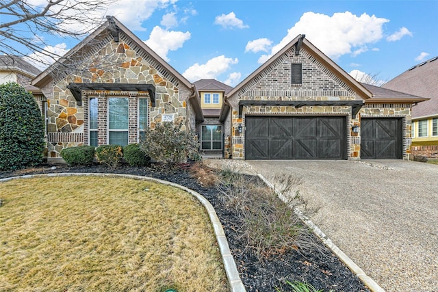 view of front of home with a garage and a front lawn