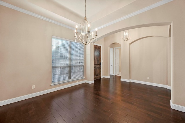 interior space with an inviting chandelier, dark hardwood / wood-style floors, a raised ceiling, and crown molding