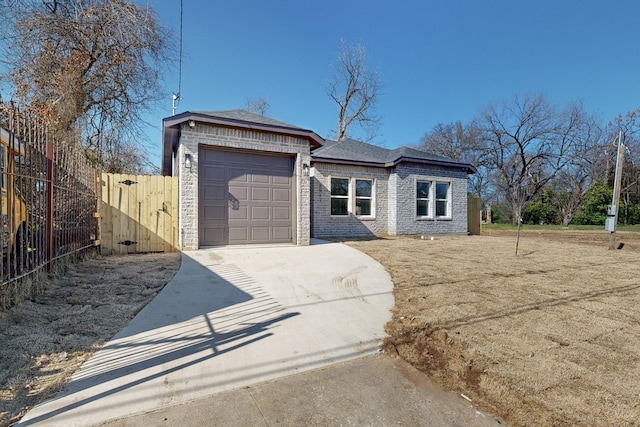 ranch-style home featuring a garage