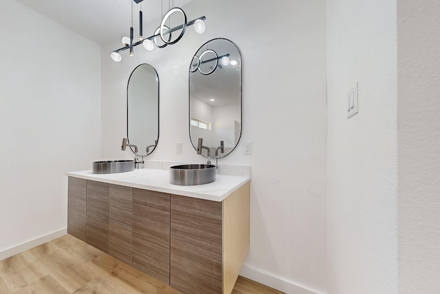 bathroom with vanity and hardwood / wood-style floors