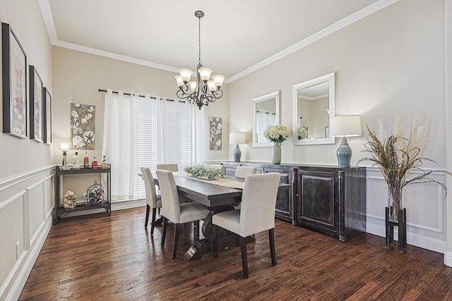 dining room with ornamental molding, dark hardwood / wood-style floors, and a chandelier