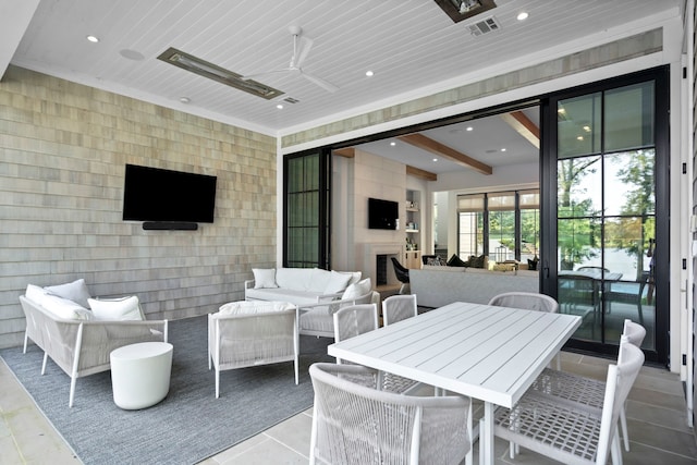 view of patio featuring ceiling fan and an outdoor hangout area