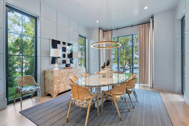 dining space with light wood-type flooring