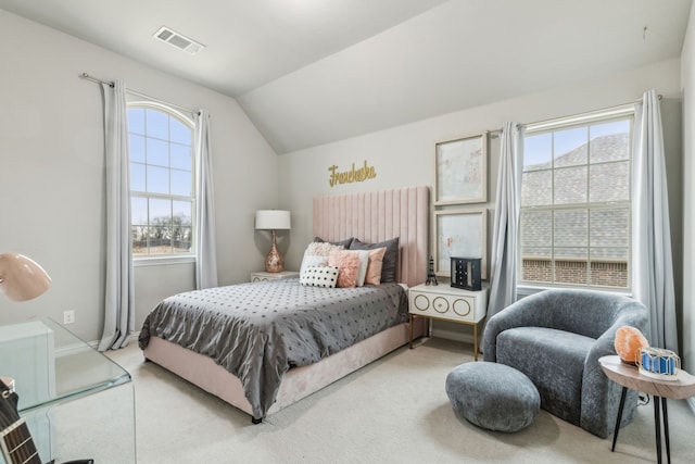 carpeted bedroom featuring vaulted ceiling