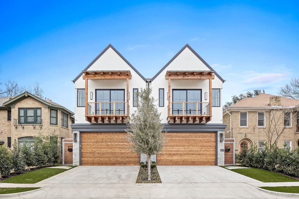 view of front of property with a balcony and a garage