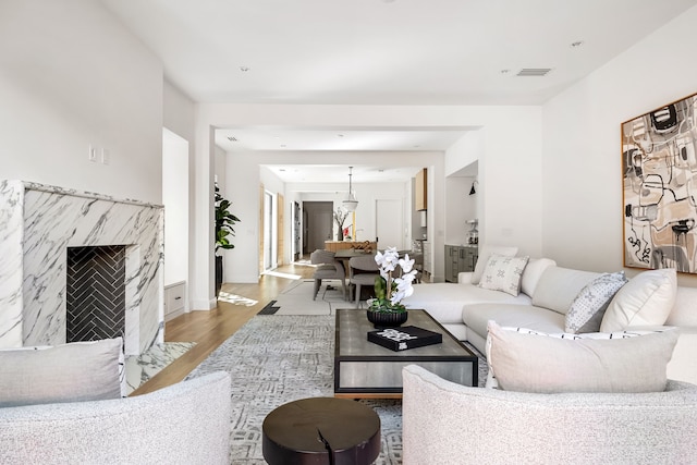 living area featuring a fireplace and wood finished floors