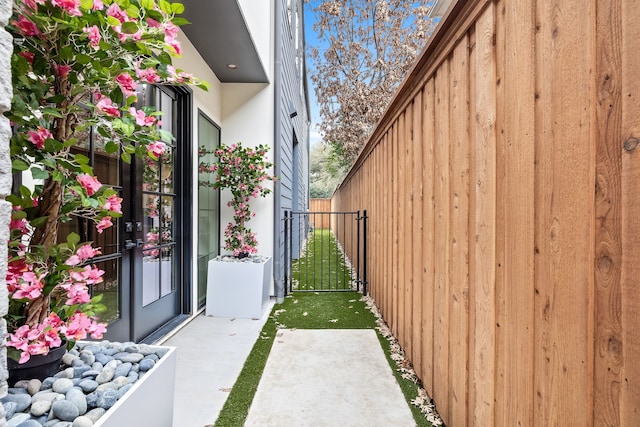 view of home's exterior with fence