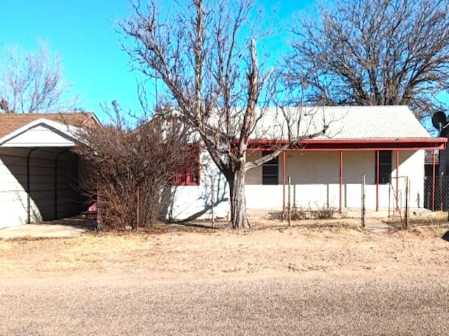 view of property exterior with a carport