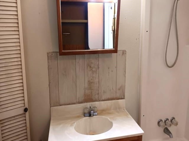 bathroom with shower / tub combination and vanity