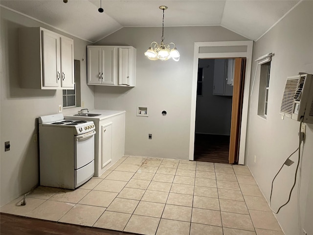 kitchen with vaulted ceiling, light tile patterned flooring, white cabinetry, sink, and electric stove