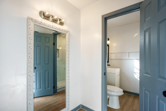 bathroom featuring toilet and hardwood / wood-style floors