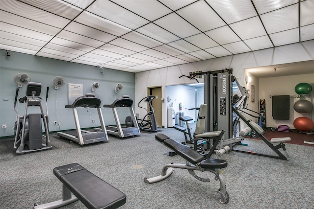 workout area featuring a paneled ceiling