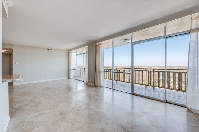 tiled empty room with expansive windows and ornamental molding