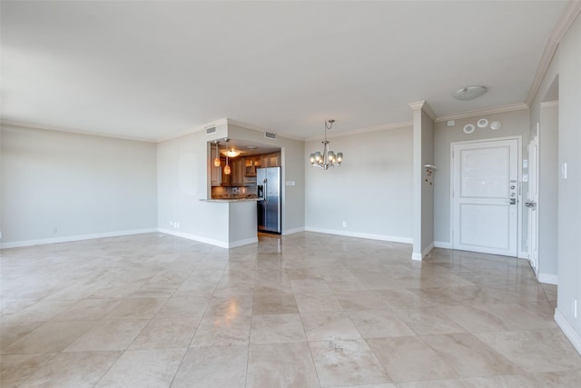 unfurnished living room featuring an inviting chandelier and crown molding