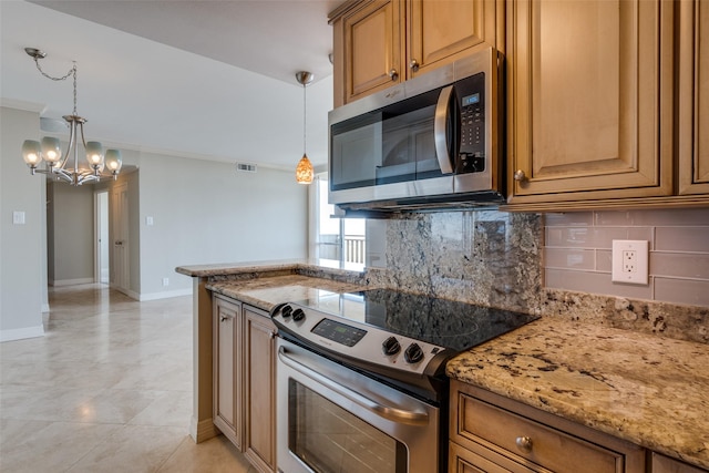 kitchen featuring light stone counters, crown molding, hanging light fixtures, appliances with stainless steel finishes, and decorative backsplash