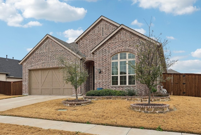 view of front of house with a garage and a front yard