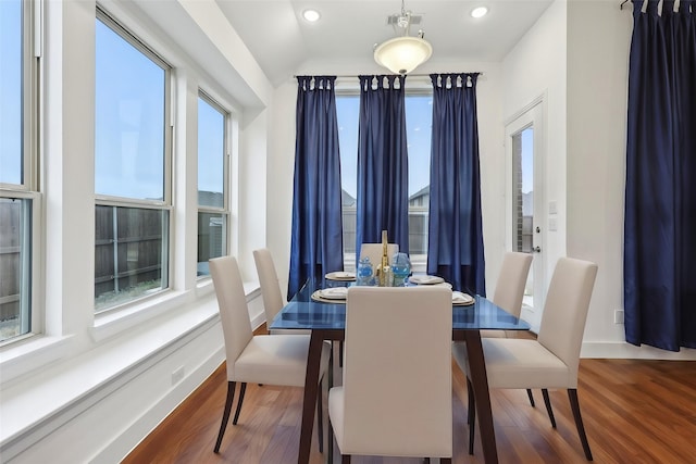 dining space with plenty of natural light and wood-type flooring