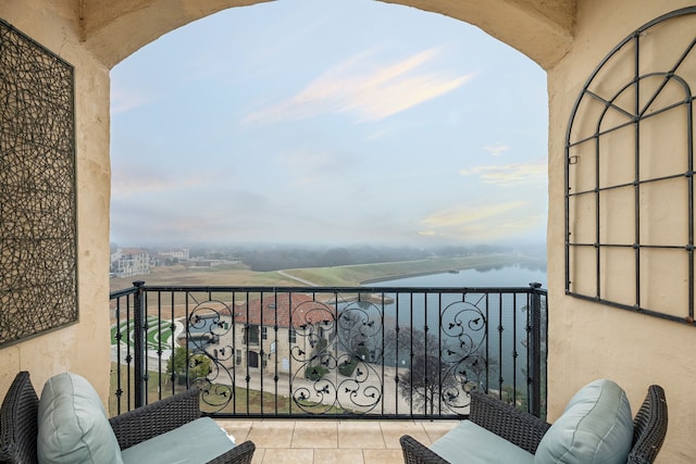 balcony featuring a water view