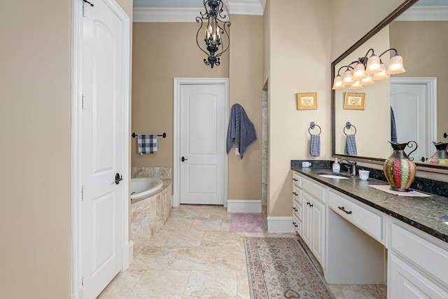 full bathroom featuring a chandelier, vanity, baseboards, ornamental molding, and a bath