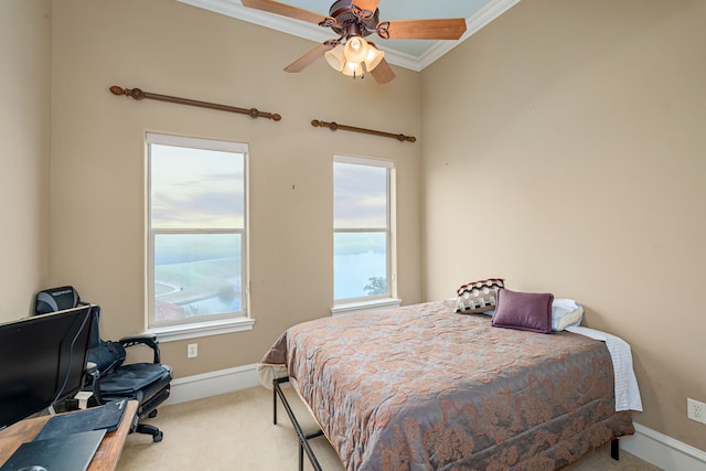 bedroom with crown molding, baseboards, ceiling fan, and carpet flooring