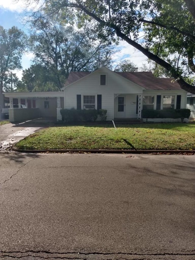 ranch-style house with a front yard