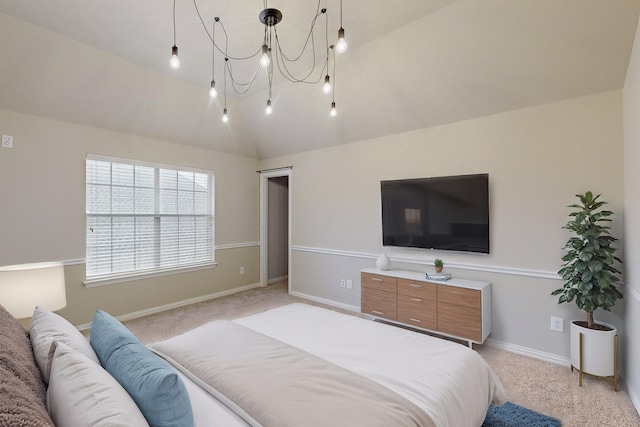 carpeted bedroom with lofted ceiling