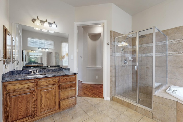 bathroom featuring vanity, tile patterned floors, and separate shower and tub