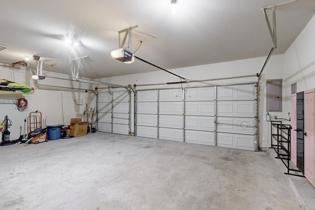 garage featuring a garage door opener and electric panel