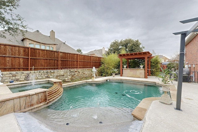 view of pool with an in ground hot tub, exterior bar, and pool water feature