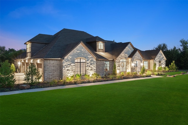 view of front of property with a lawn