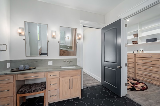 bathroom featuring tile patterned floors and vanity