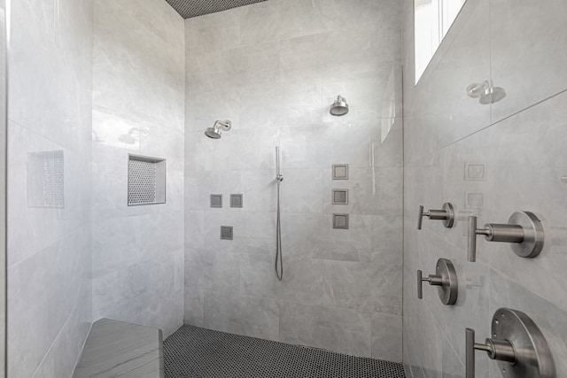 bathroom featuring tiled shower