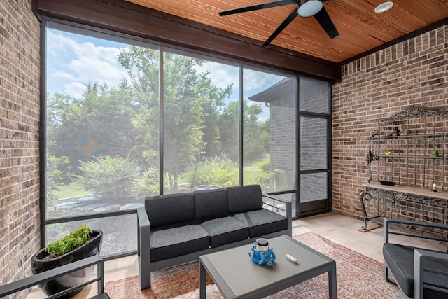 sunroom with wood ceiling and ceiling fan