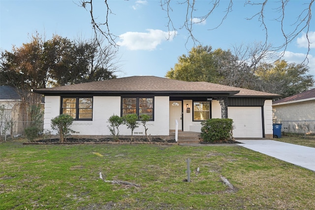 view of front of house with a garage and a front yard