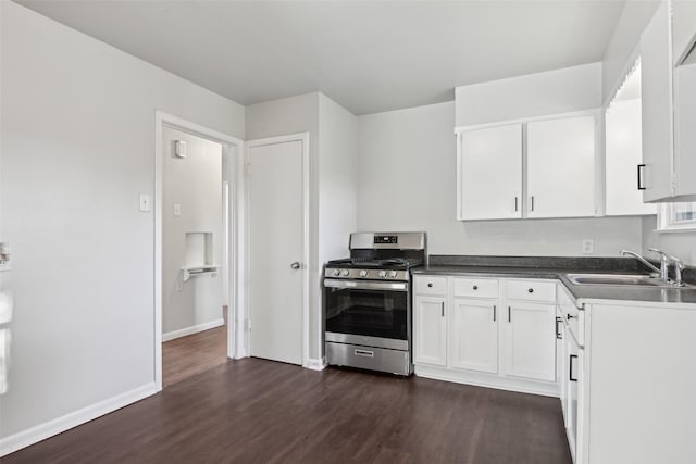 kitchen with white cabinetry, dark hardwood / wood-style floors, sink, and gas stove