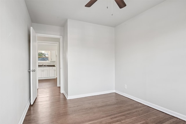 spare room with hardwood / wood-style flooring and ceiling fan