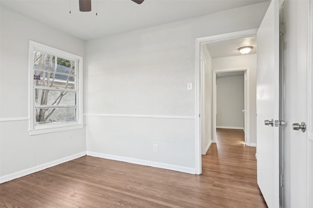 empty room featuring hardwood / wood-style flooring and ceiling fan