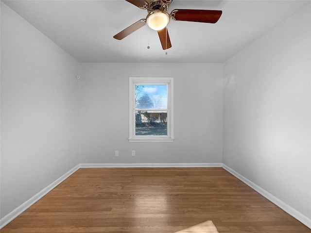 empty room with wood-type flooring and ceiling fan