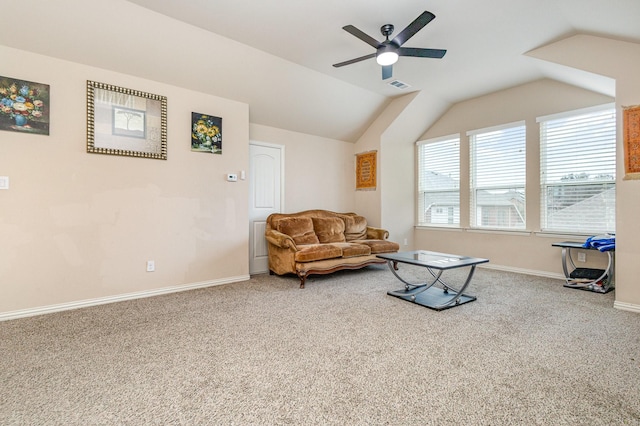 sitting room with ceiling fan, lofted ceiling, and carpet