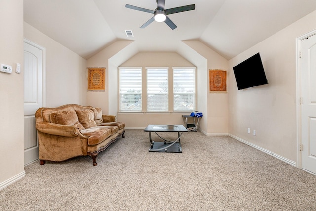 sitting room with vaulted ceiling, carpet flooring, and ceiling fan